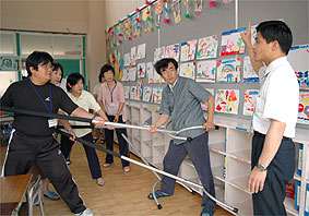 Teachers practice using Sasumata at school